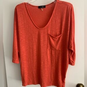 Laila Jayde lightweight orange sweater.